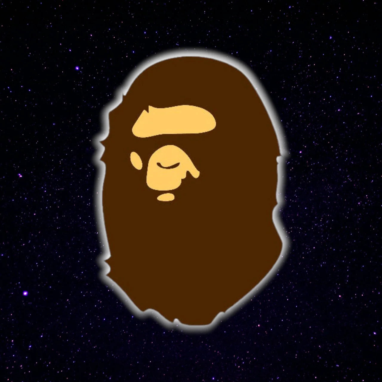 Logo of a stylized monkey face with a brown beard on a dark starry background